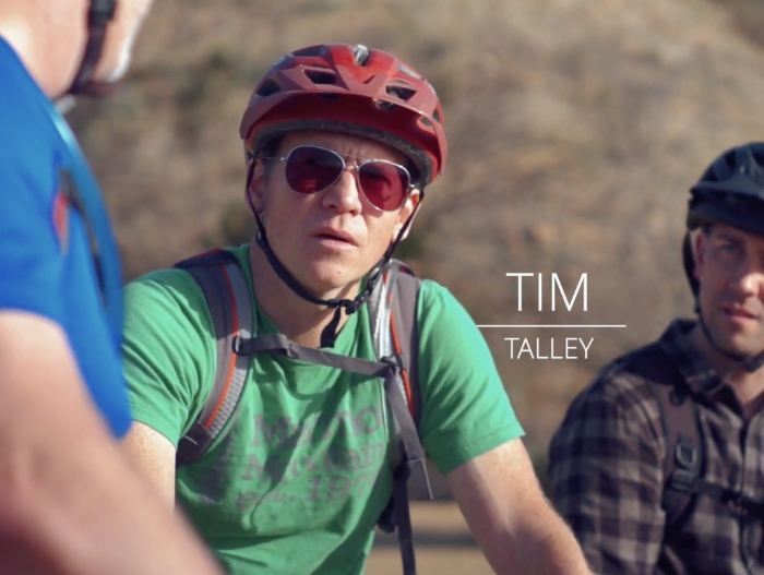 man wearign sun glasses and bike helmet