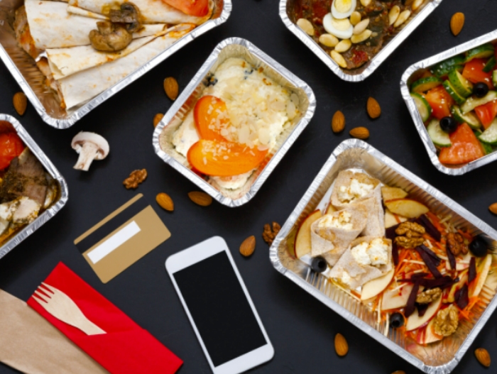 prepared meals on table with phone