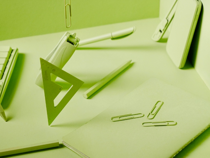 paper clips on notepad with green overlay