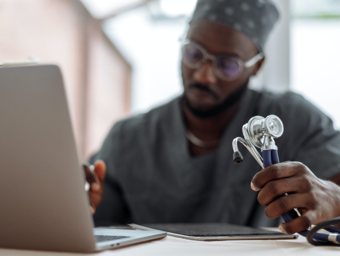 black doctor using laptop