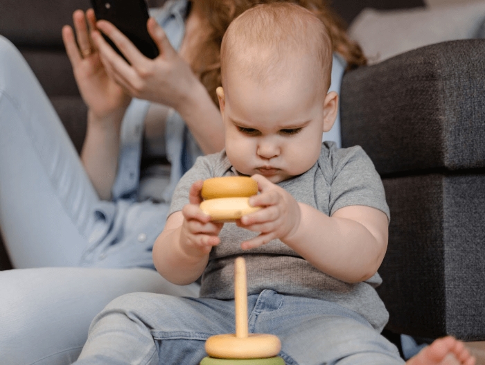 baby holding a toy