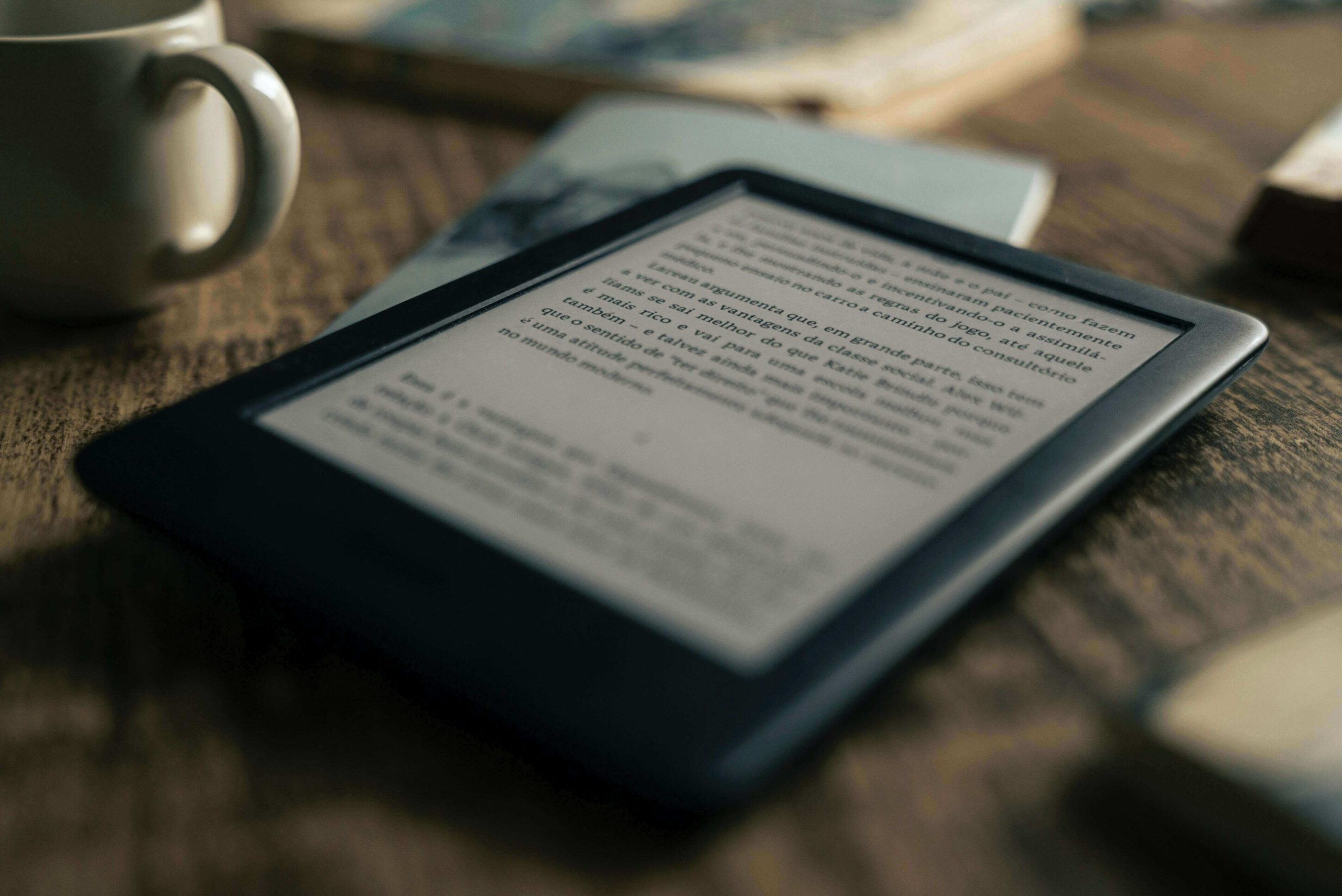 A kindle and cup of coffee