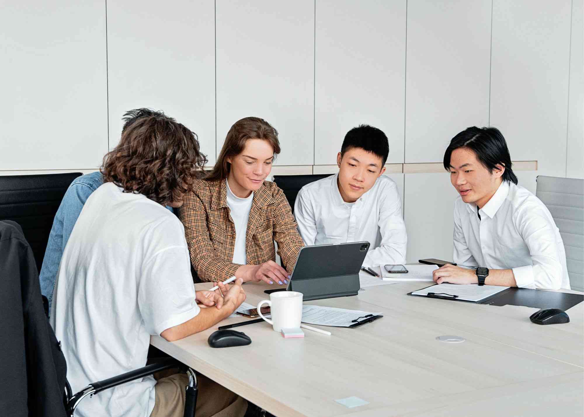 group of people on computer in office