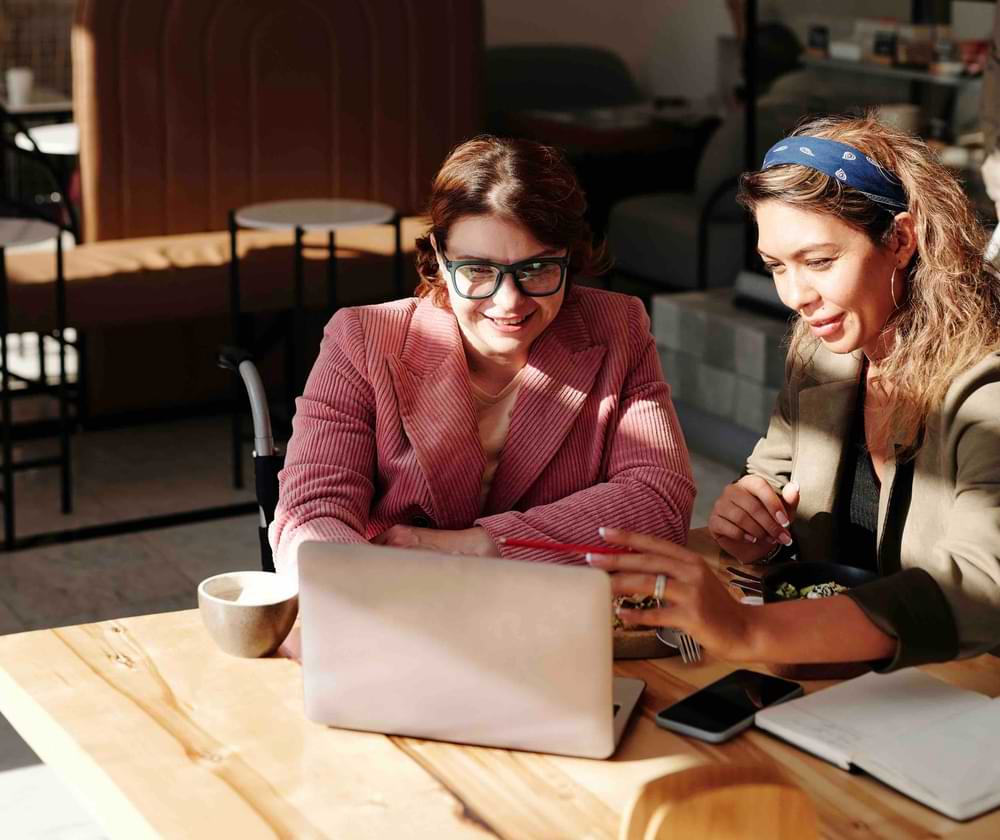 group of people on computer in office