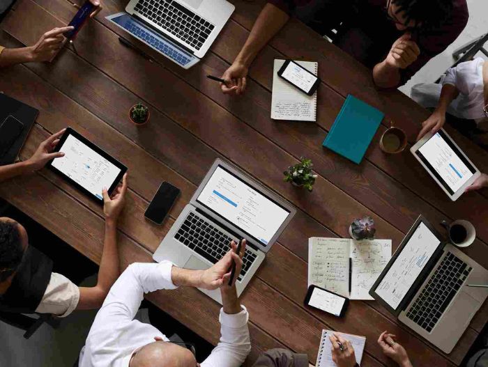 group of colleagues working with computers