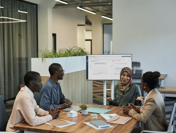 group of people sitting around a conference table