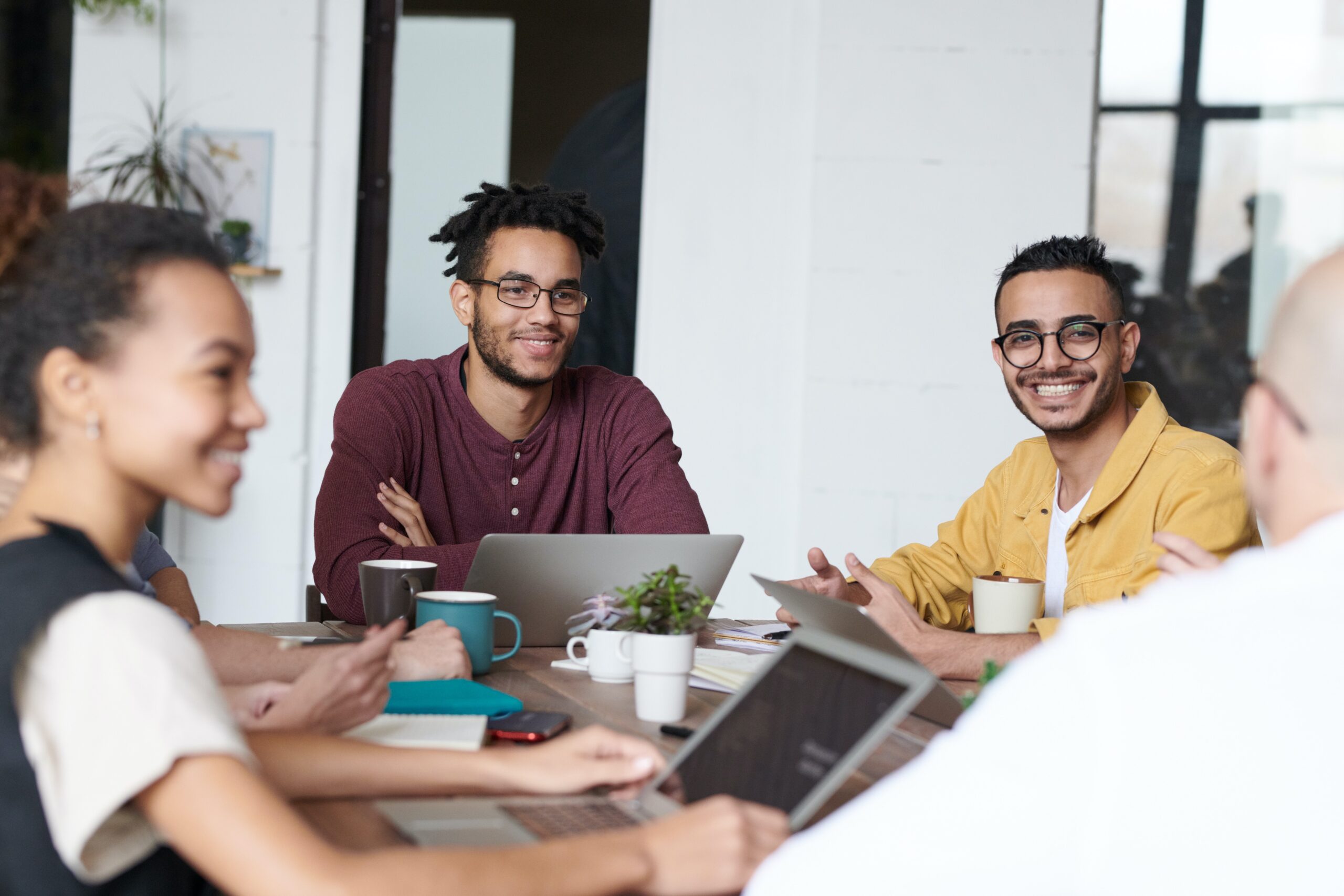 group of people sitting around a conference table