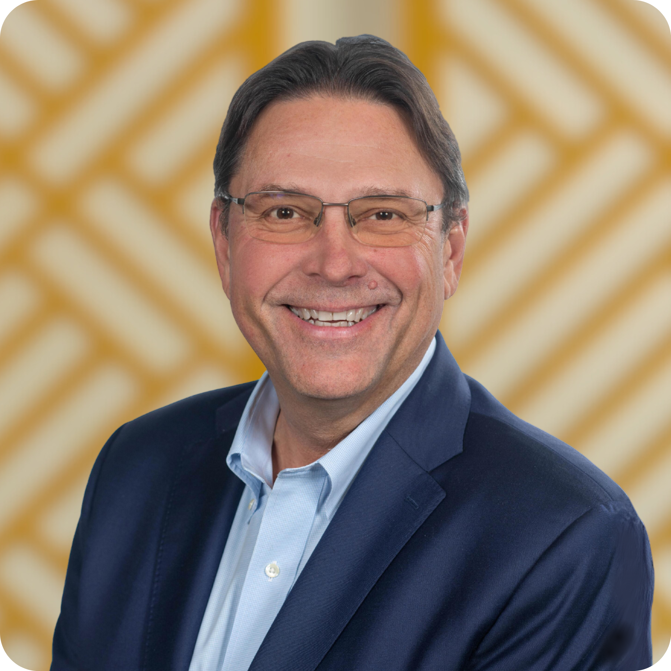 Jonathan Flatow in front of a yellow background